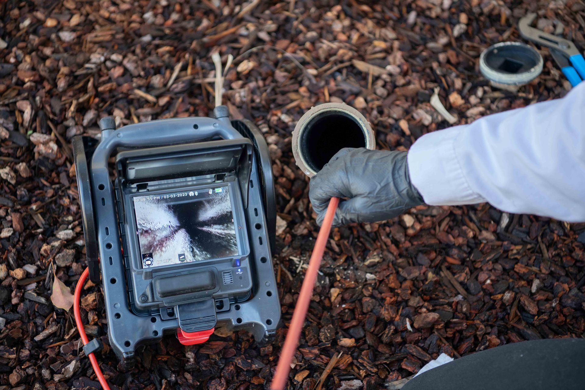 A sewer inspection camera checking a pipe