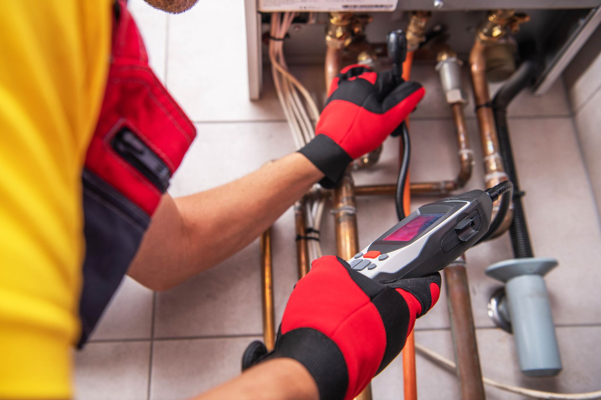 A technician uses a digital multimeter to test connections