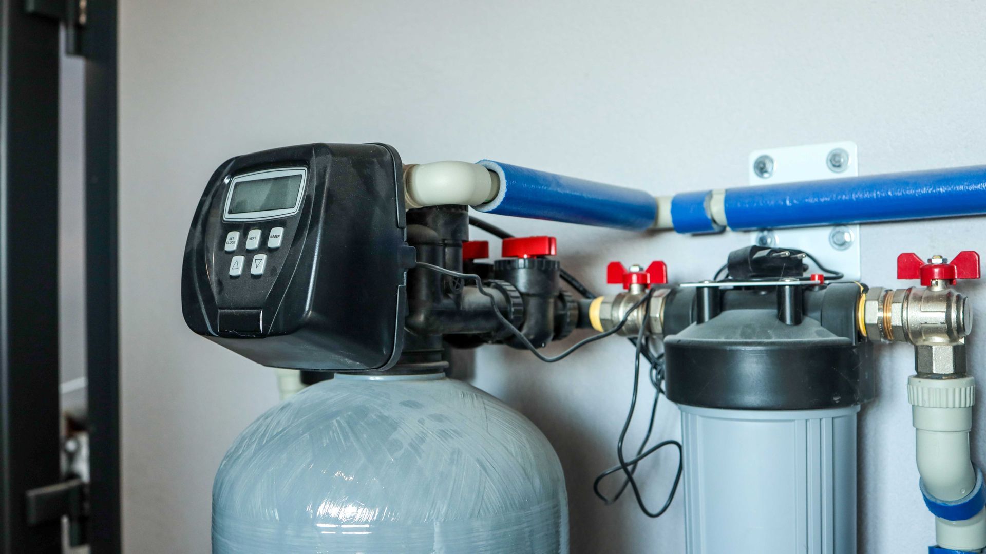 A whole-house water filtration and softening system