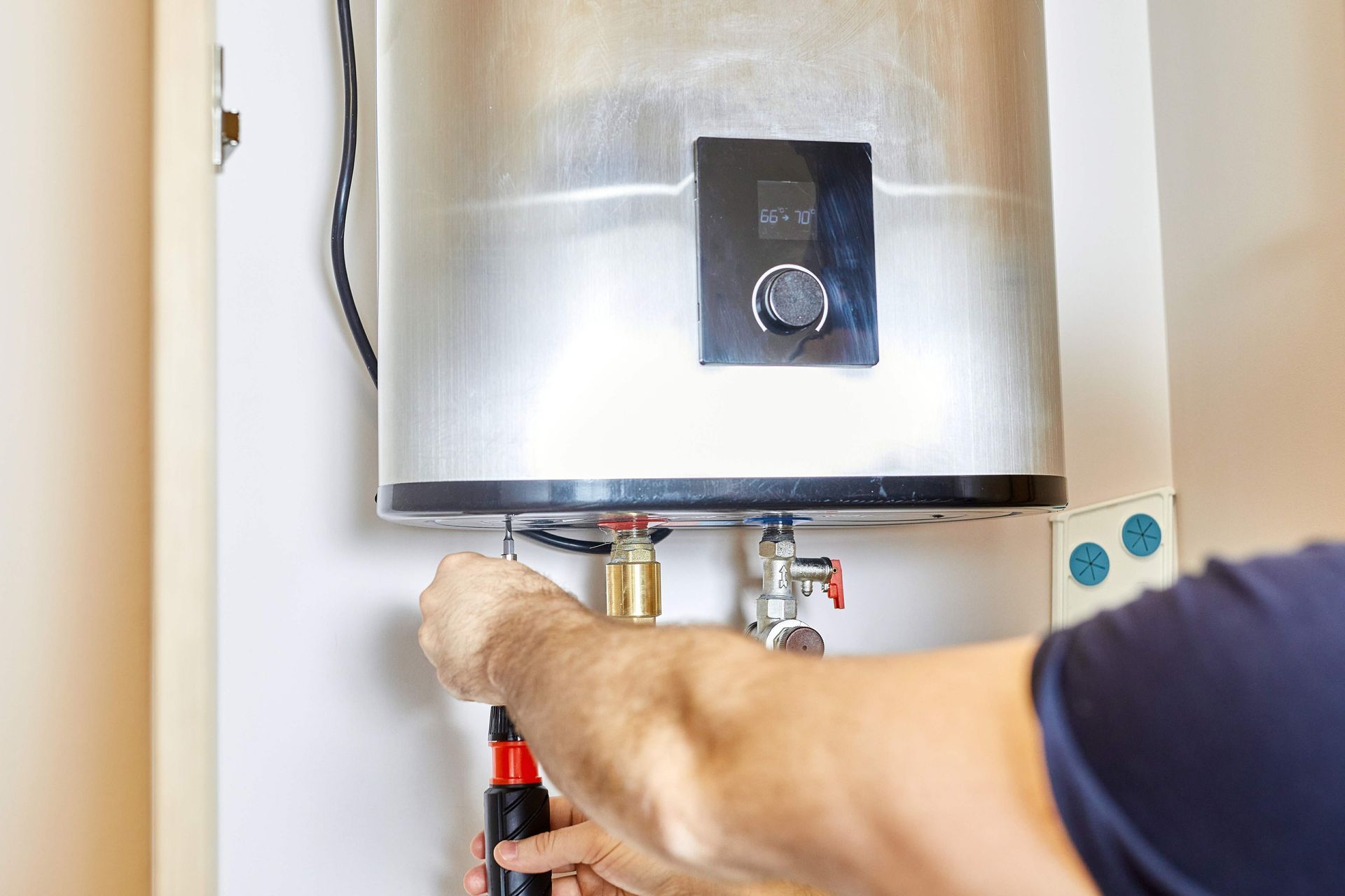 A wall-mounted tankless water heater